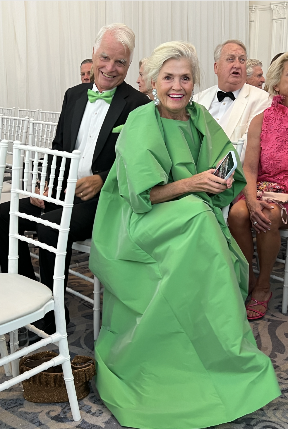 older woman in a bright green maxi dress looking fabulous. Silver Fox Energy at A Black Tie Affair